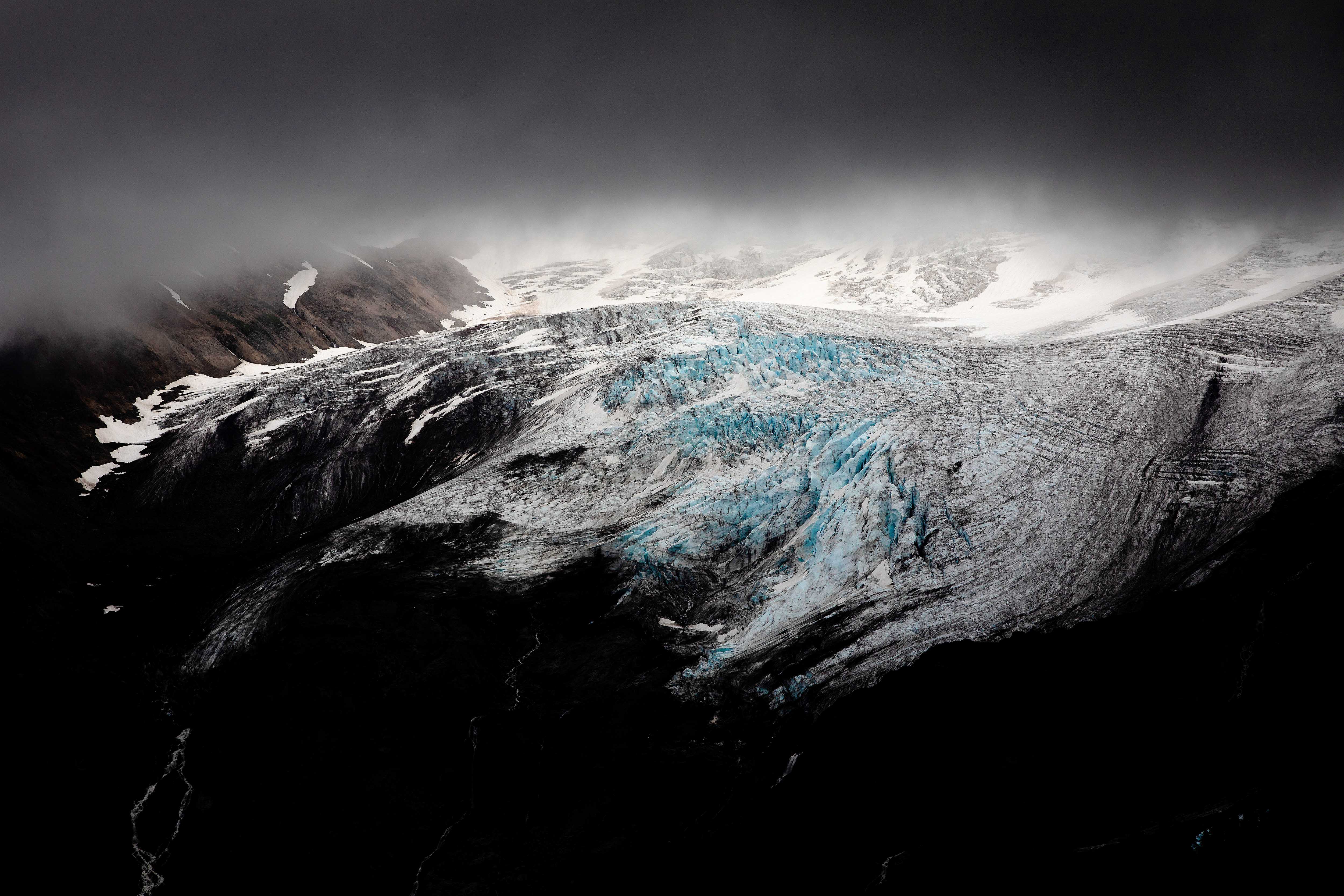 A storm approaches a glacier.