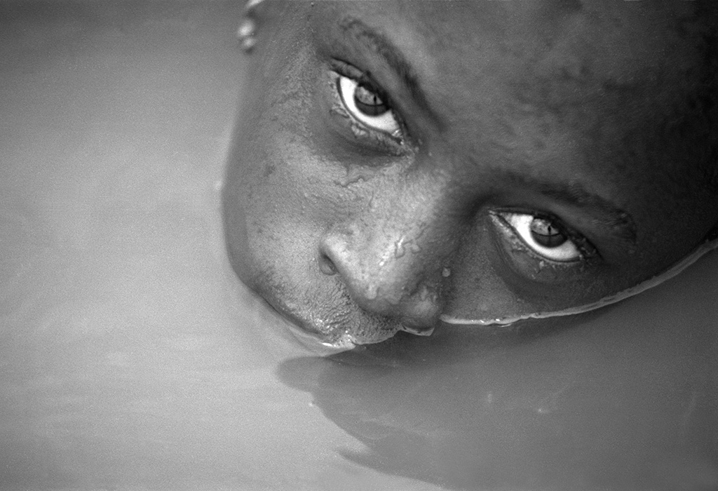 Photograph of a boy in water in Guinea Bissau