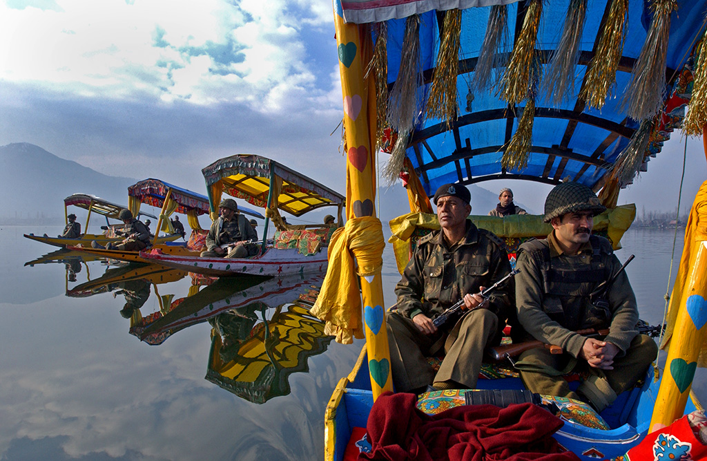 Photograph of military men on boats on a lake in Kashmir