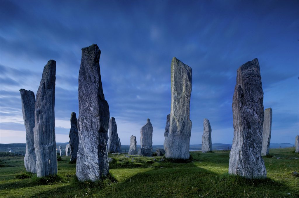 Large stones stand erected in a circle.