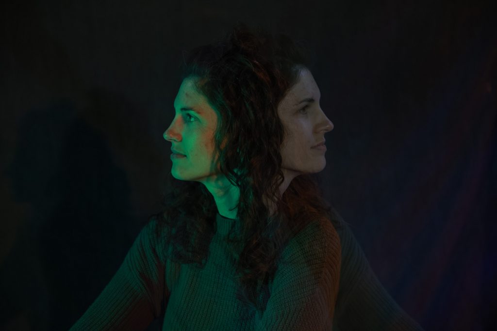 Double exposure photograph of a young woman looking left and right