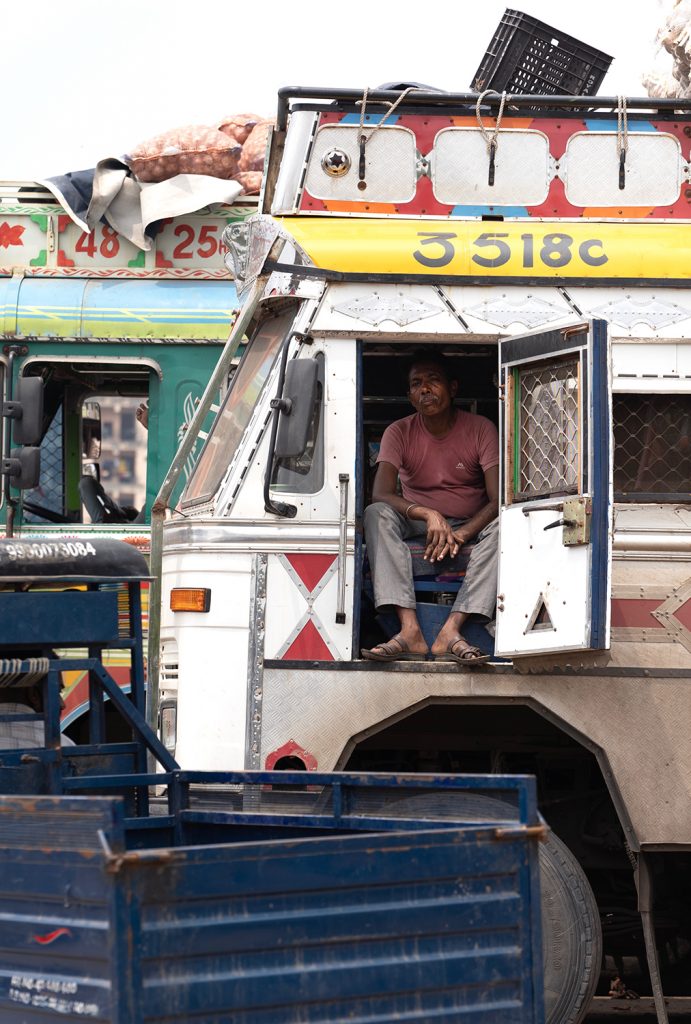 Photograph of a man sitting in a truck